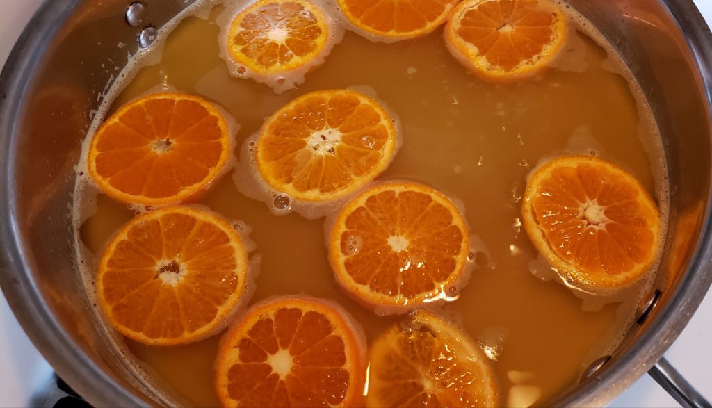 Take the hassle out of cooking breakfast for a crowd with these super easy, delightfully tasty candied orange sheet pan pancakes with warm spiced syrup.