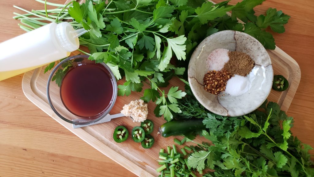 Perfect for grilled flank steaks to chicken, pork and seafood- this spicy cilantro chimichurri is sure to be your new favorite summertime sauce!