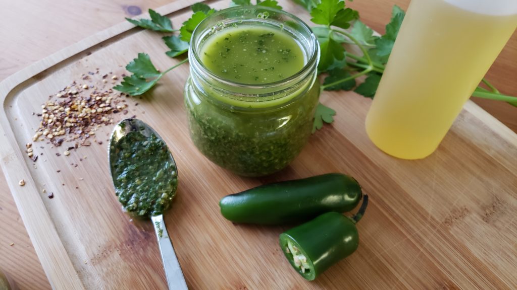 Perfect for grilled flank steaks to chicken, pork and seafood- this spicy cilantro chimichurri is sure to be your new favorite summertime sauce!