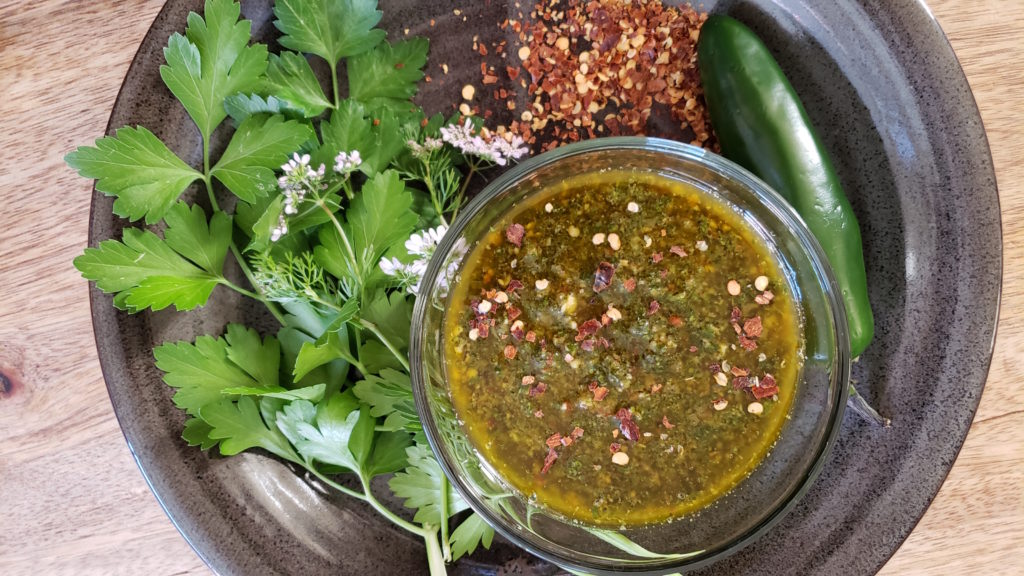 Now that you broke out the grill it’s time to break out the FLAVOR. Perfect for grilled flank steaks to chicken, pork and seafood- this spicy cilantro chimichurri is sure to be your new favorite summertime sauce!