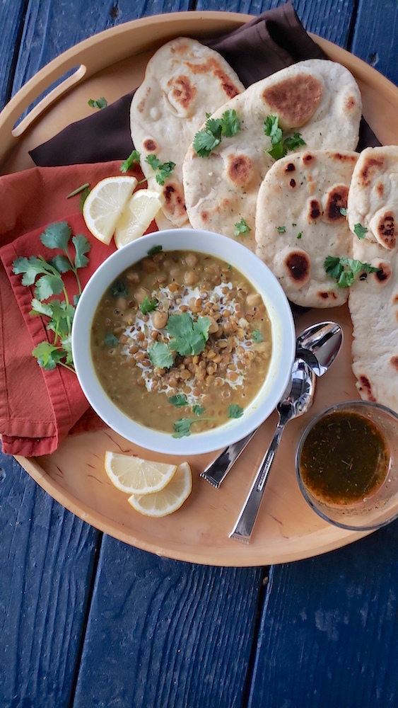 Easy herbed garlic naan! Made with yogurt or sour cream, this fluffy bread recipe will be a new favorite. So quick and delicious!