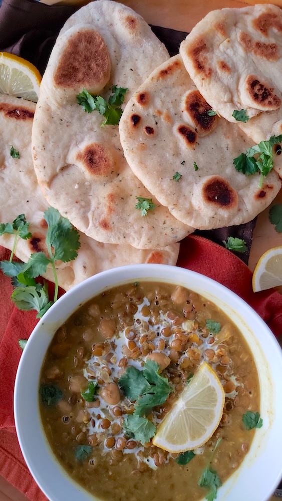 Easy herbed garlic naan! Made with yogurt or sour cream, this fluffy bread recipe will be a new favorite. So quick and delicious!